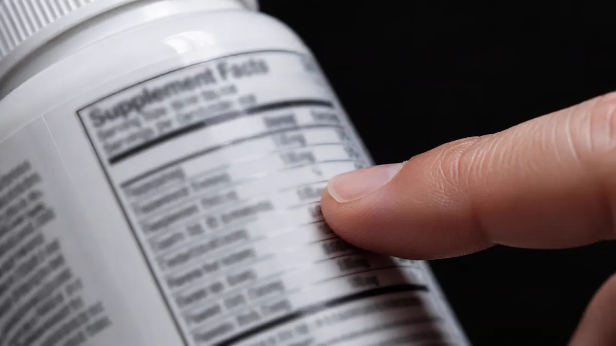 Close-up of hands examining a real or clearly generic supplement facts label